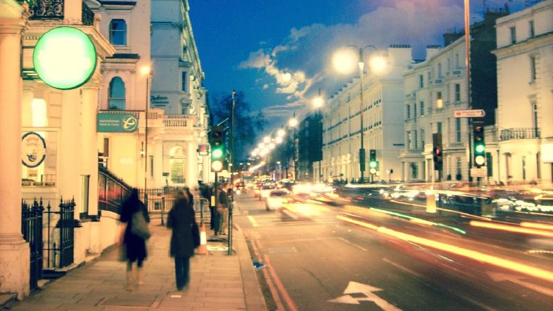 Photograph of traffic lights in a city.