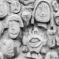Photograph of stone carved faces.